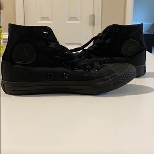 Black high top Converse sneakers